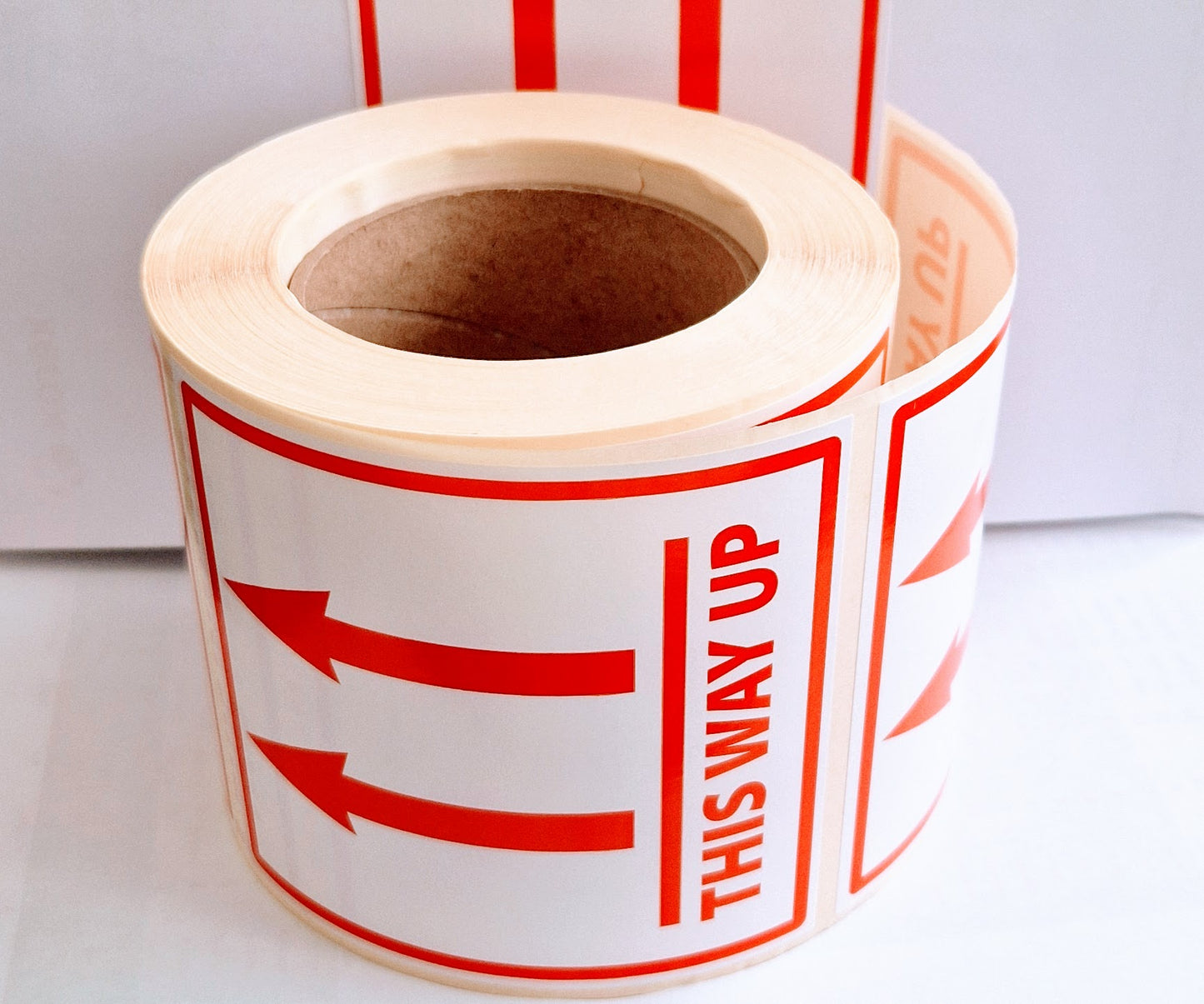 Roll of THIS WAY UP LABELS 110 X 120 mm text and arrows on a white background